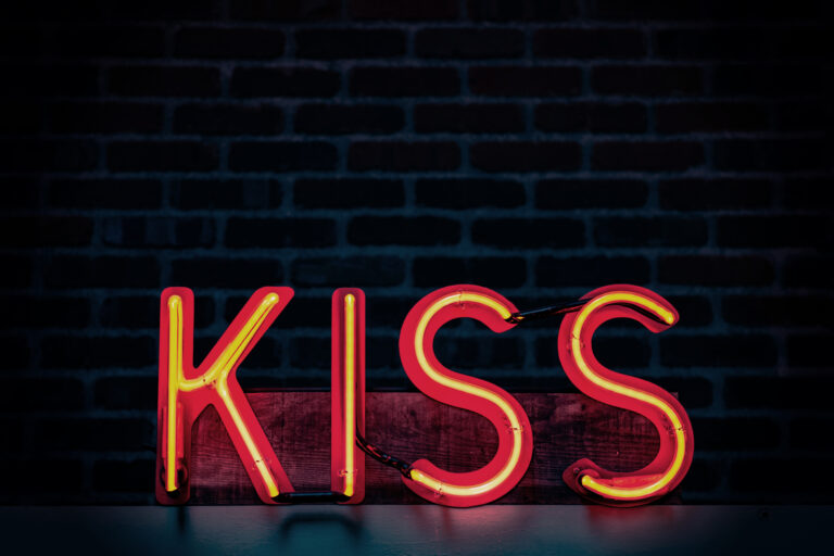 red-kiss-neon-light-signage-on-dark-lit-room-1115681